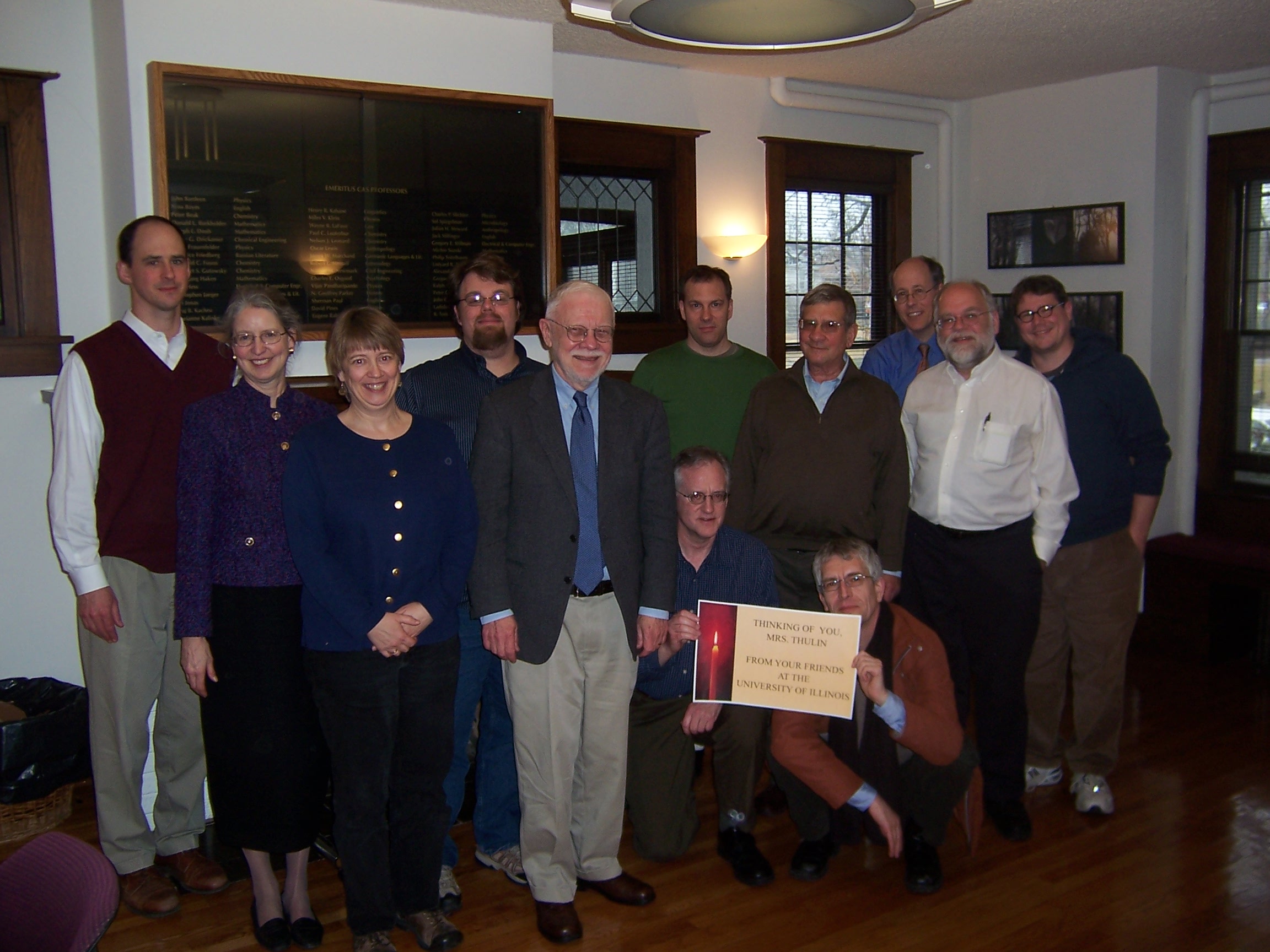 (1) Lunch party for Prof. Butler at the Center for Advanced Study. Pictured: (l. to r., standing) Jon Ebel, Janet Rasmussen, Rachel Rasmussen, Cody Harris, Jon Butler, Chris Higgins, Walter Feinberg, David Price, Wayne Pitard, Nathan Raybeck; (l. to r., kneeling) Robert McKim, Alexander Mayer